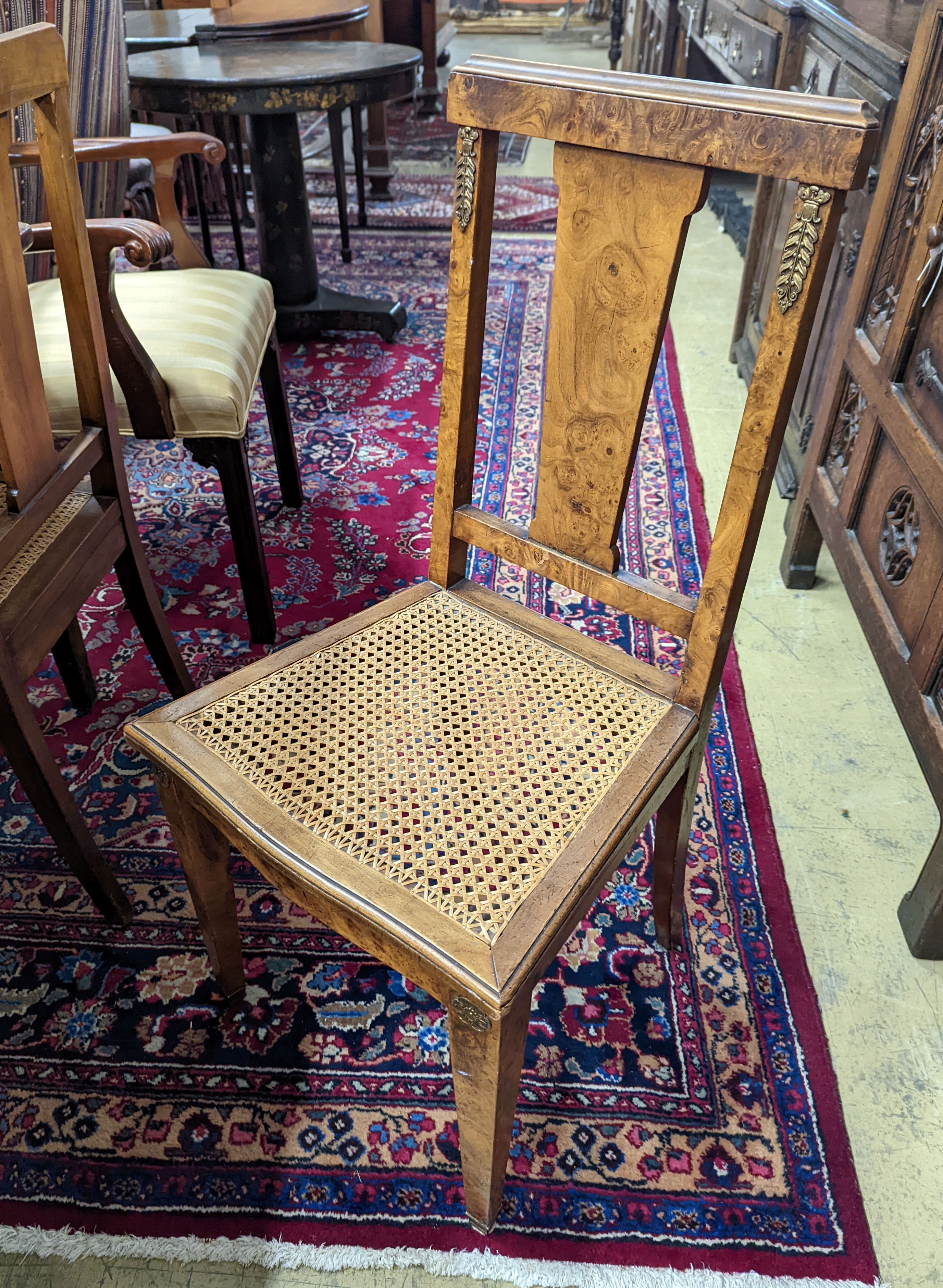 A set of six early 20th century French walnut and gilt metal mounted chairs. 50-70
